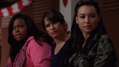 Three Women Sitting Together One In Pink Hoodie GIF