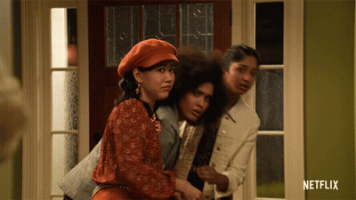Three Women Standing In Front Of A Door With A Netflix Logo On The Bottom GIF