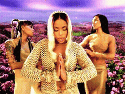 Three Women Standing In Front Of A Field Of Flowers GIF