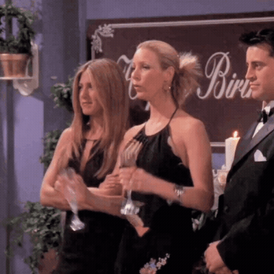Three Women Standing In Front Of A Sign That Says Birdie GIF