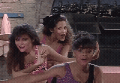 Three Women Standing Together One Holding Arm GIF