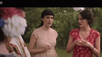 Three Women Talking With Wine Glasses In Park GIF