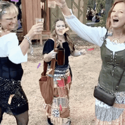 Three Women Toasting With Arms In Air GIF