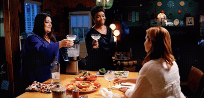 Three Women Toasting With Drinks And Food GIF