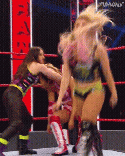 Three Women Wrestling In Ring Holding Hair GIF