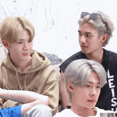 Three Young Men Are Sitting On A Couch And One Of Them Is Wearing A Hoodie That Says Soulwar 'S On It GIF