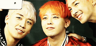 Three Young Men Posing For A Picture With One Of Them Having Red Hair GIF