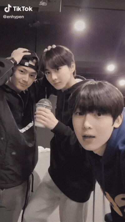 Three Young Men Posing One Sticking Tongue Out GIF