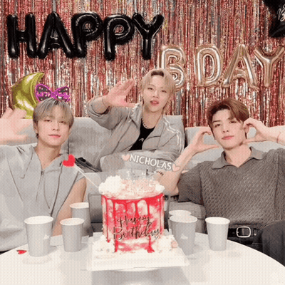 Three Young Men Sitting In Front Of Happy Birthday Cake GIF