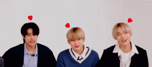 Three Young Men With Hearts On Heads GIF