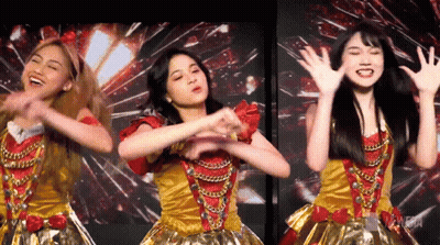 Three Young Women Dancing In Gold And Red Outfits GIF