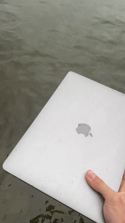 Throwing Computer Laptop On The Sea GIF