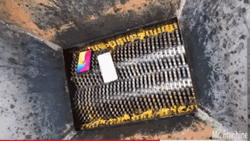 Throwing Phone Into The Shredder GIF