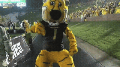 Tiger Mascot Dancing In Front Of West Sign GIF