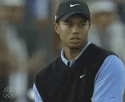 Tiger Woods Is Wearing A Black Nike Hat And A Blue Shirt GIF