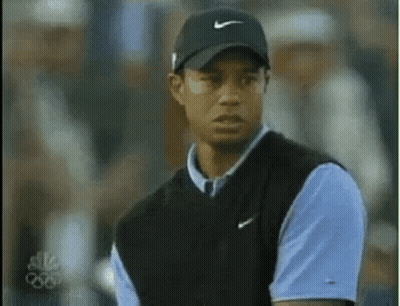 Tiger Woods Wearing Black Hat And Blue Shirt GIF