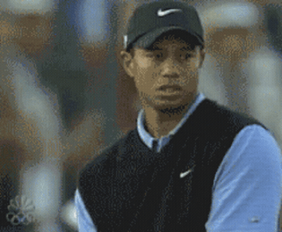 Tiger Woods Wearing Black Nike Hat And Blue Shirt GIF