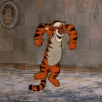 Tigger From Winnie The Pooh Is Dancing In A Room In Front Of A Wall . GIF