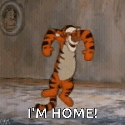 Tigger From Winnie The Pooh Is Dancing In A Room With The Words `` I 'M Home '' . GIF