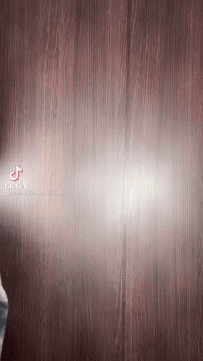TikTok Video Person Standing On Wooden Surface GIF