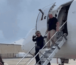 Tim Walz Going Down The Airplane GIF