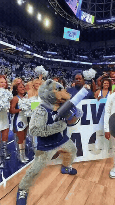 Timberwolves Mascot Holding Megaphone In Front Of Crowd GIF