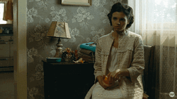 Timid India Eisley Peeling An Orange GIF