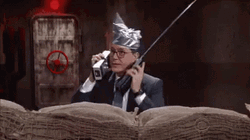Tin Foil Hat On Talking To Himself GIF