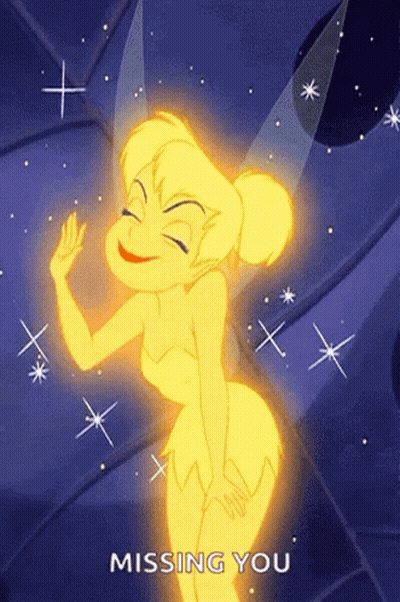 Tinkerbell From Peter Pan Is Smiling And Waving At The Camera While Missing You . GIF