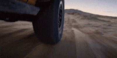 Tire On Sandy Road Close Up GIF