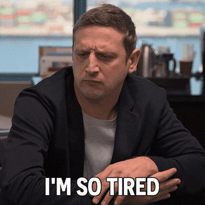 Tired Man Sitting At Table GIF
