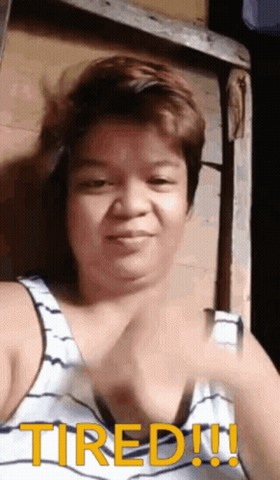 Tired Woman In Tank Top Making Funny Face GIF
