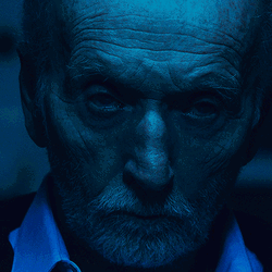 Tobin Bell Serious Face In Saw Movie GIF