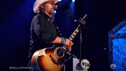 Toby Keith Raised The Guitar GIF