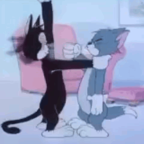 Tom And Jerry Are Dancing Together In A Living Room . GIF