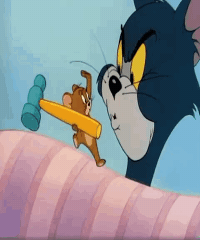 Tom And Jerry Holding Hammers In Mouths GIF