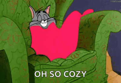 Tom And Jerry Sitting In Chair With Pink Blanket GIF
