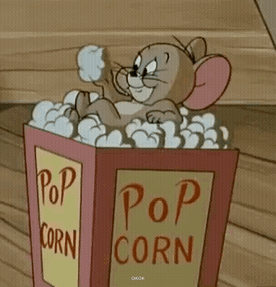 Tom And Jerry Sitting In Popcorn Box GIF