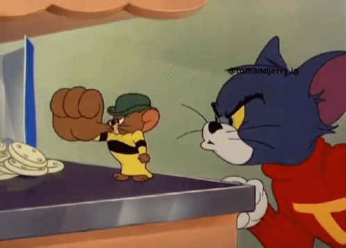Tom And Jerry Standing On A Table GIF