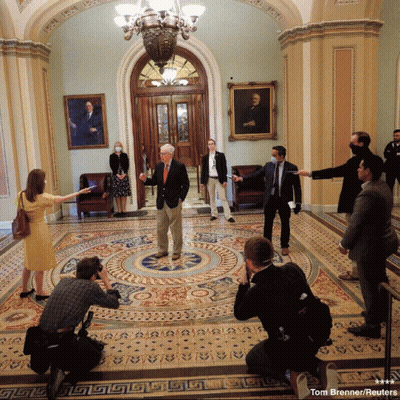 Tom Brenner Reuters Photographing Group In Hallway GIF