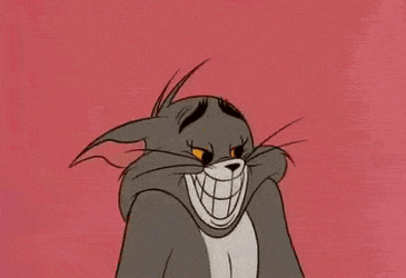 Tom Cat Grinning And Shrugging Shoulders GIF