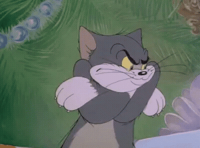Tom Cat Hugging Paws And Smiling GIF