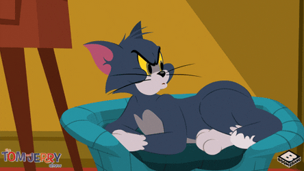 Tom Cat Punching His Bed GIF