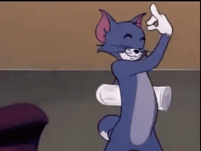 Tom From The Cartoon Tom And Jerry Is Giving The Middle Finger While Holding A Cup . GIF