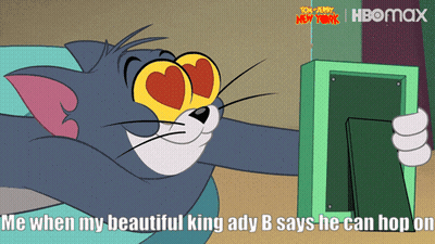 Tom Holding Picture Frame With Hearts GIF