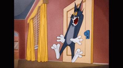Tom Standing In Front Of Door GIF