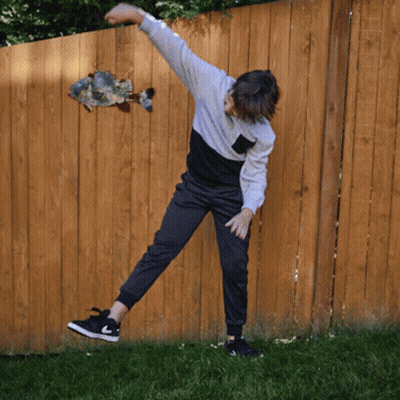 Tom Sticking Tongue Out By Trash Bags GIF