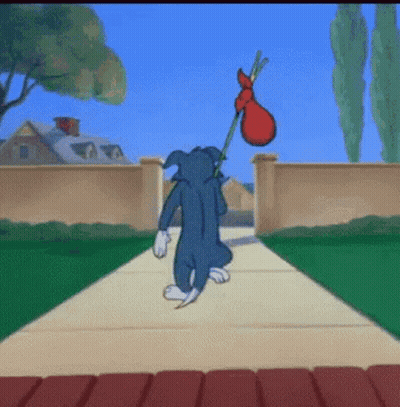Tom Walking With Red Bag GIF