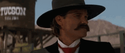 Tombstone Kurt Russel Laughing Hard GIF