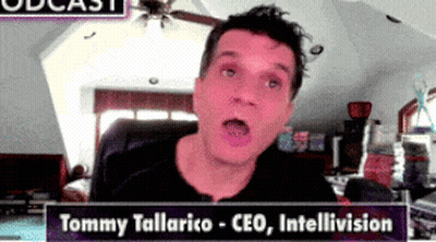 Tommy Tallarico CEO Of Intellivision Sitting In Chair With Mouth Open GIF